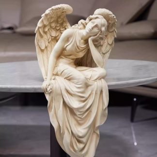 Antique-Style Resin Sculpture of a Seated Angel with Weathered Finish